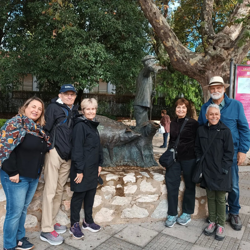Seniors Spanish abroad group visiting the ham museum in Aracena