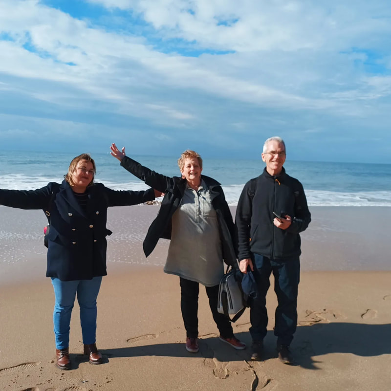 Seniors Spanish abroad group visiting the beach in Cádiz