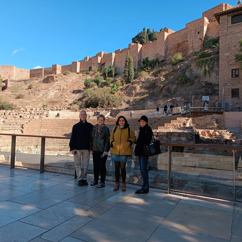 Seniors Spanish abroad group visiting Malaga's Roman Theater
