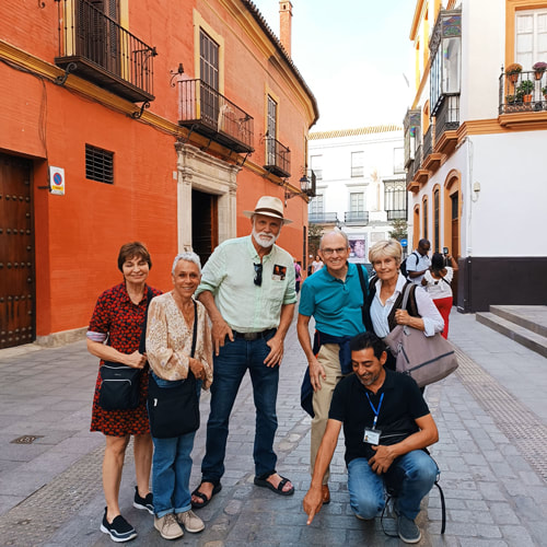 Seniors Spanish abroad group visiting Seville's Jewish quarter